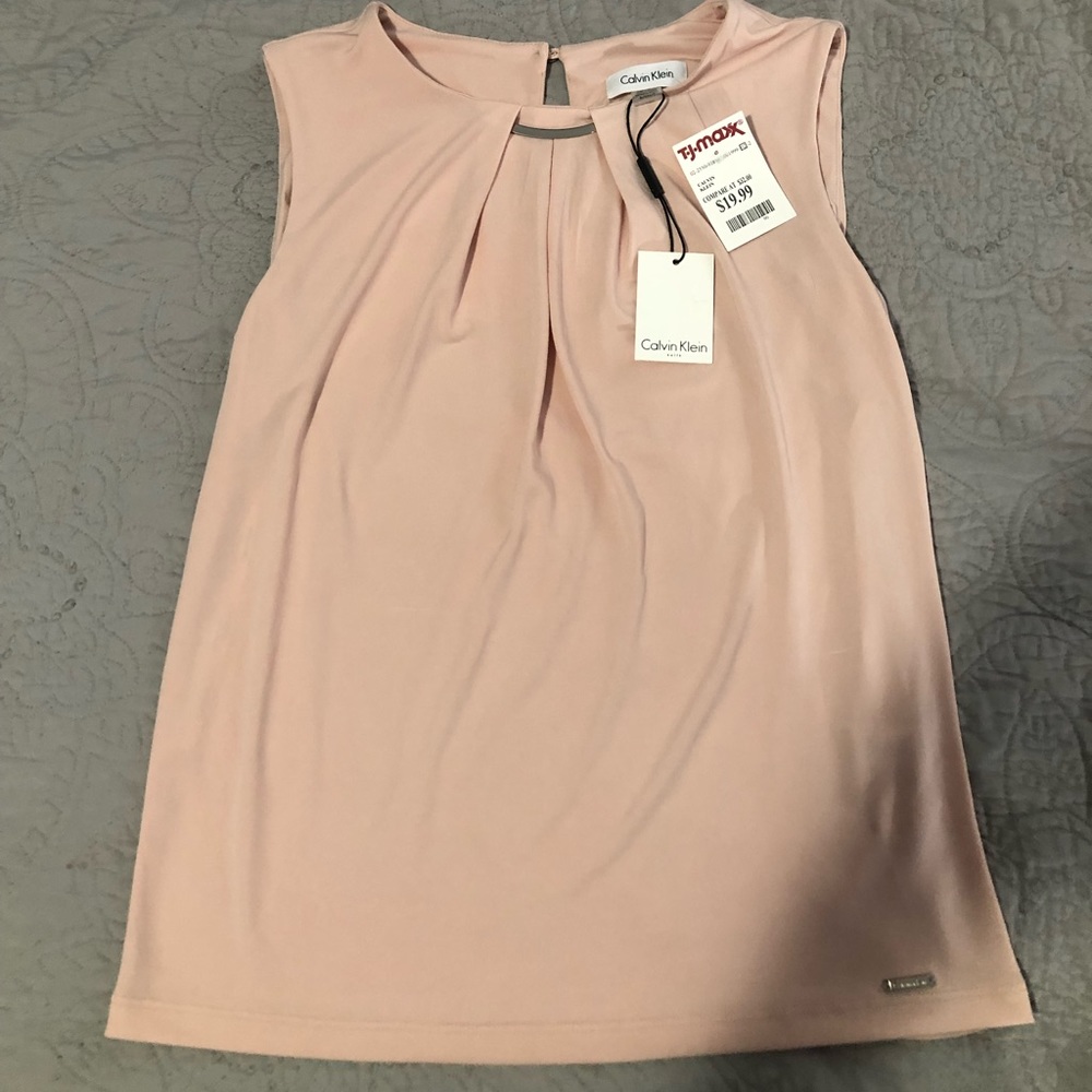 Light blush pink  blouse, was a gift never worn.